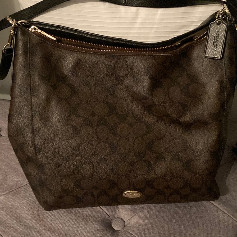 Coach brown and black shoulder or crossbody signature pattern, gold hardware.